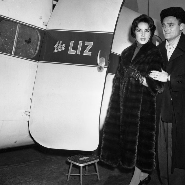 Elizabeth Taylor and her husband, producer Mike Todd, board his private plane named The Liz