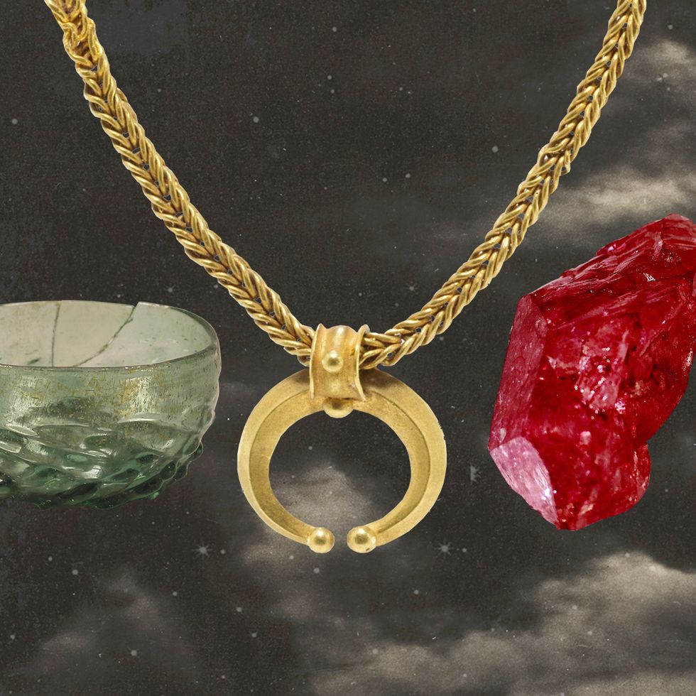 a necklace with a pendant, a stone, and a bowl