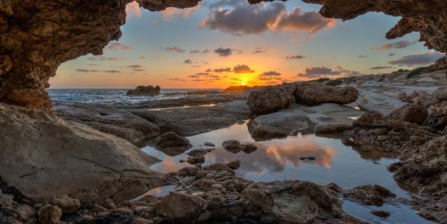Cave on seashore at sunset, Cyprus
