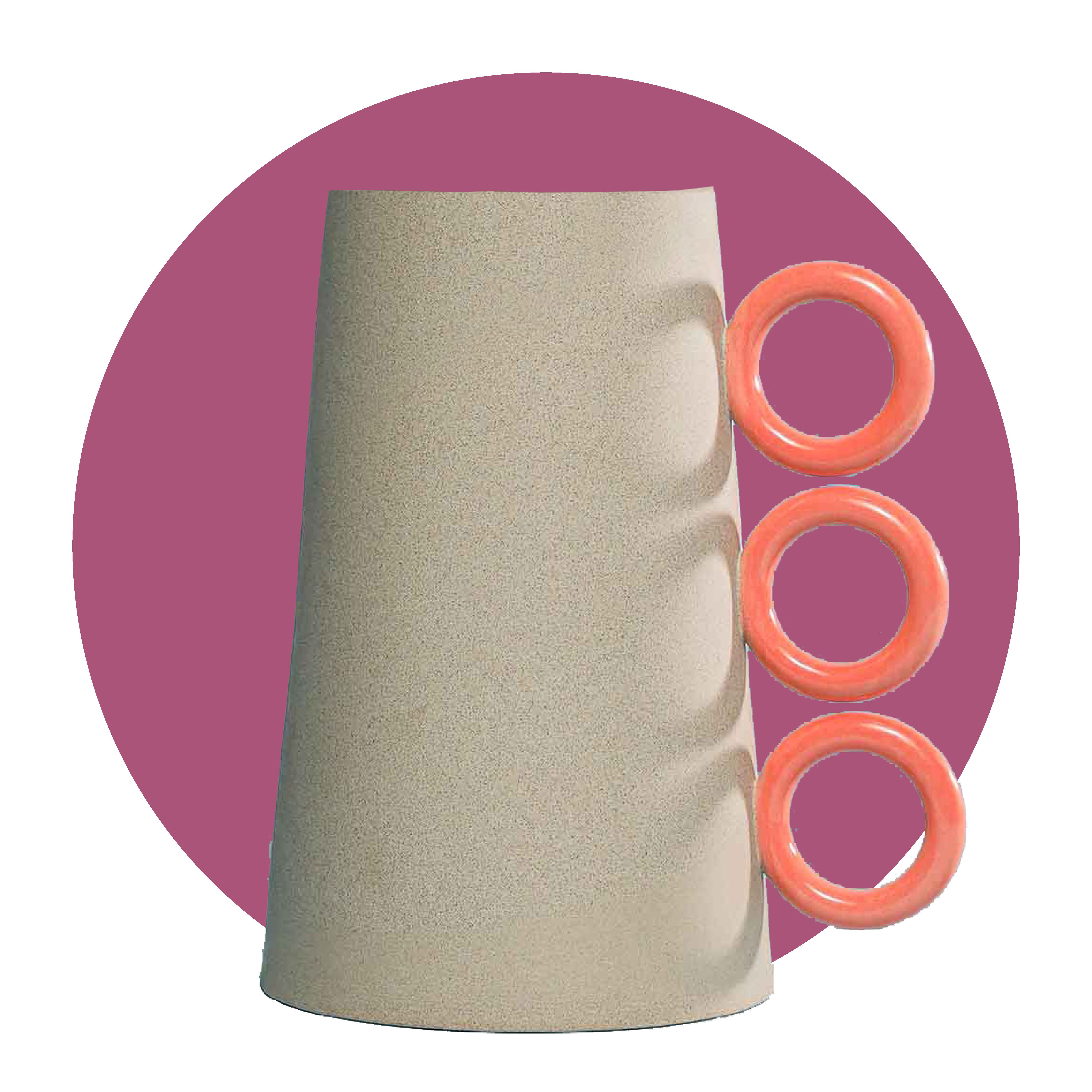 a ceramic vase with orange accents