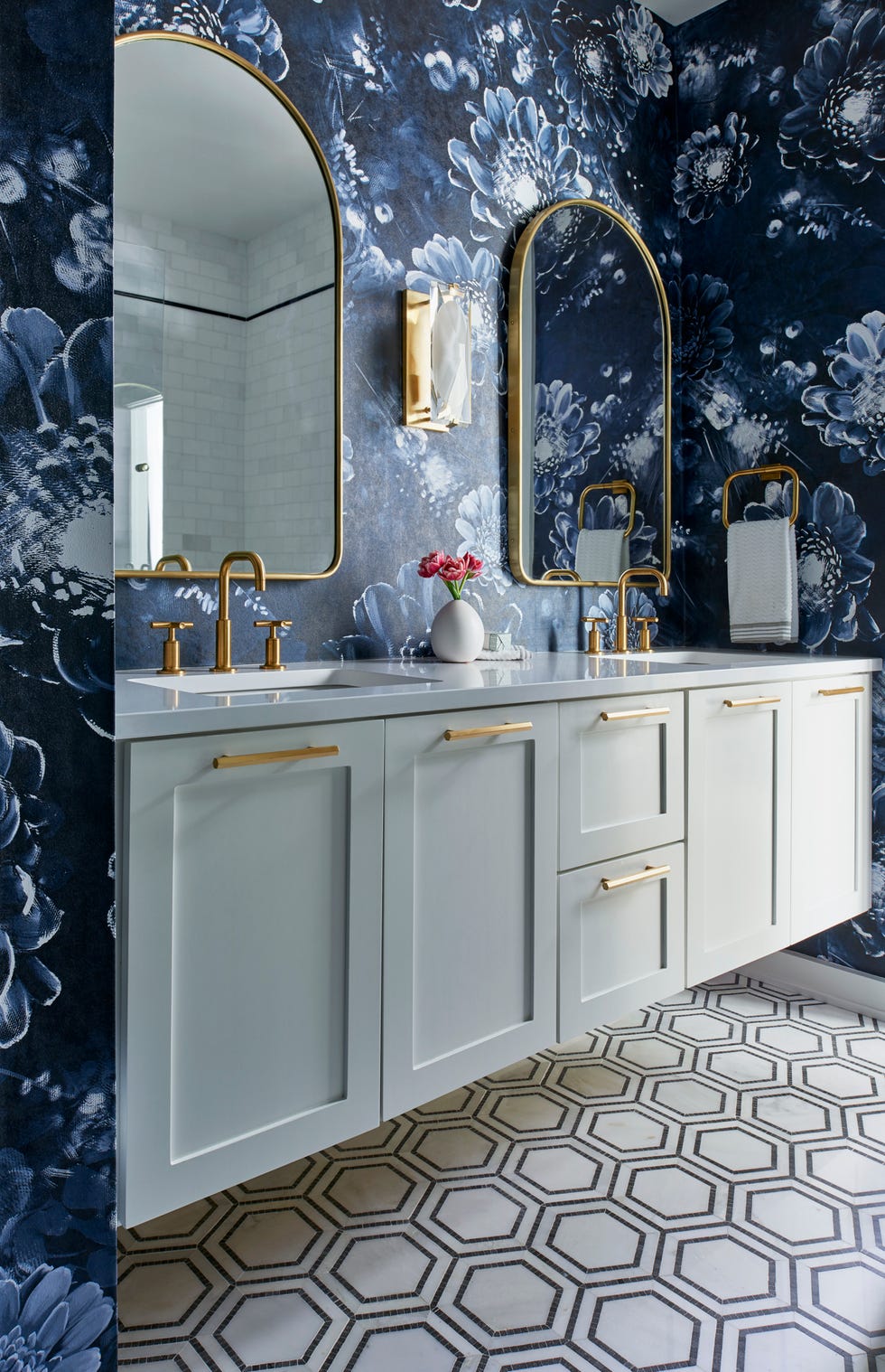 elegant bathroom with floral wallpaper and a modern vanity