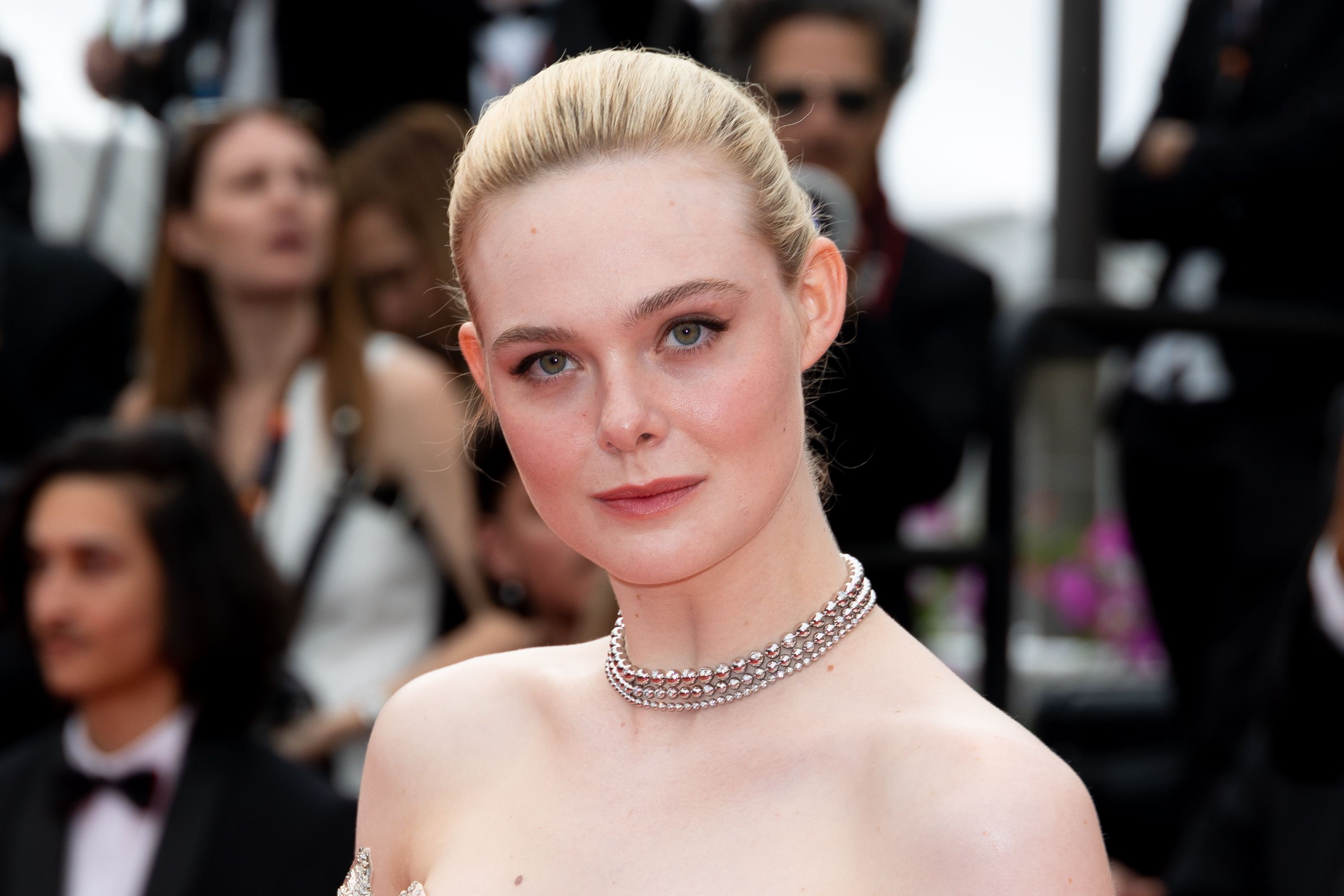 Elle Fanning Takes Paris in an Electric Silver Slipdress Covered