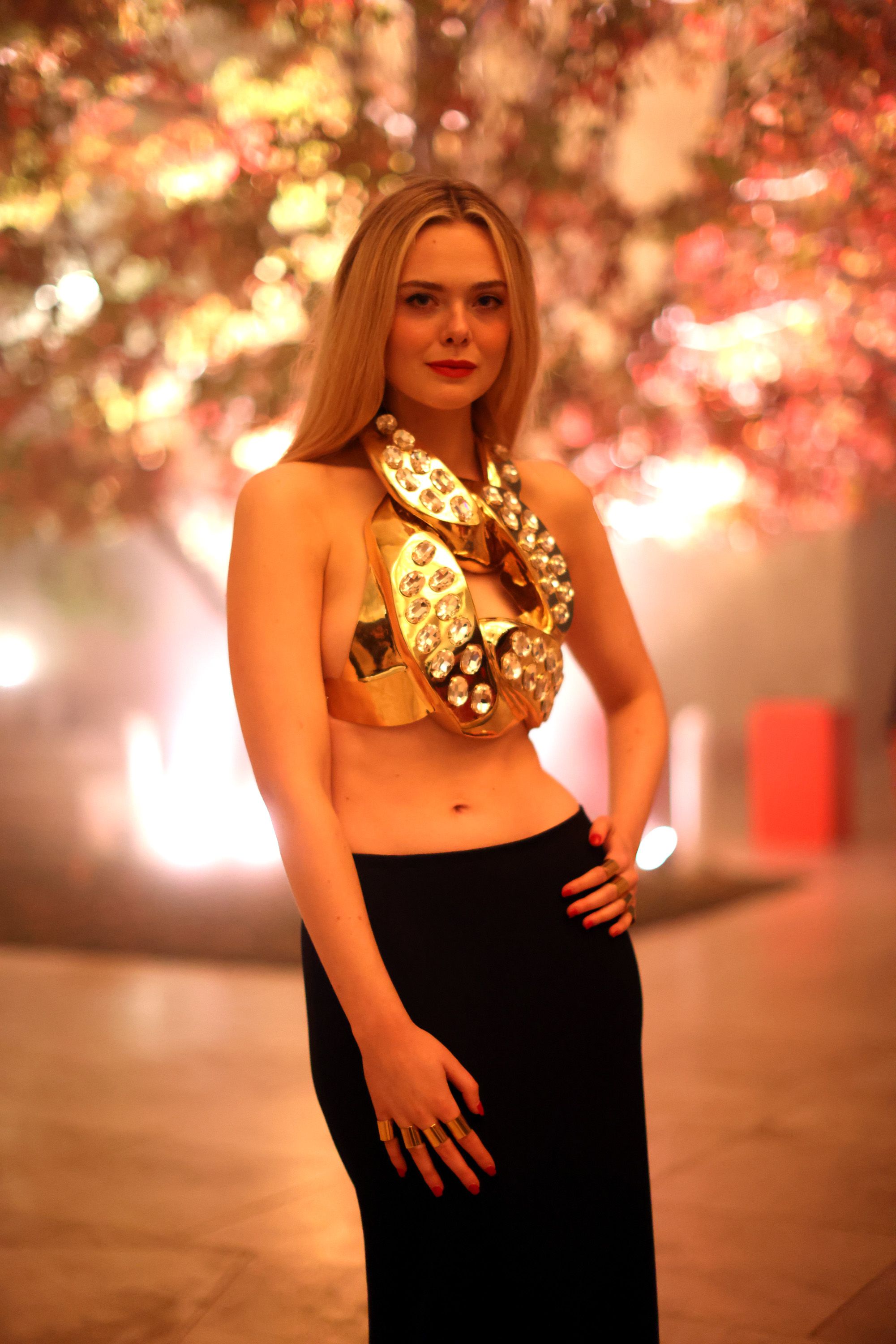 Elle Fanning Wore a Giant Gold Chain Crop Top in Los Angeles