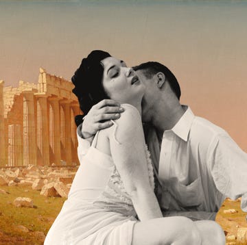 ruins of the parthenon with couple in passionate embrace