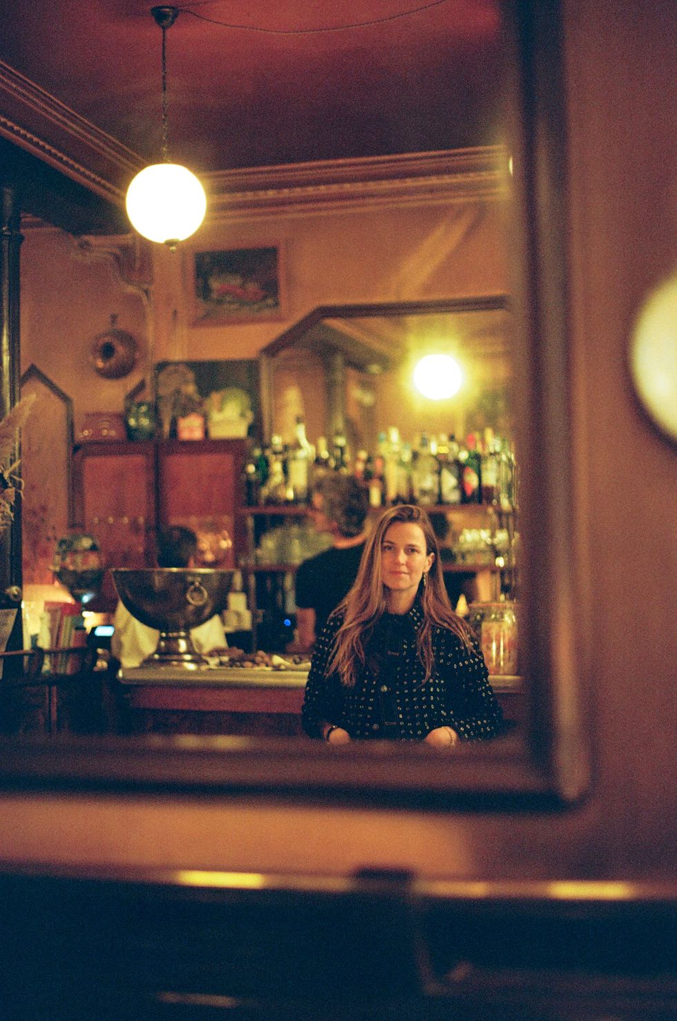 a person sitting at a bar