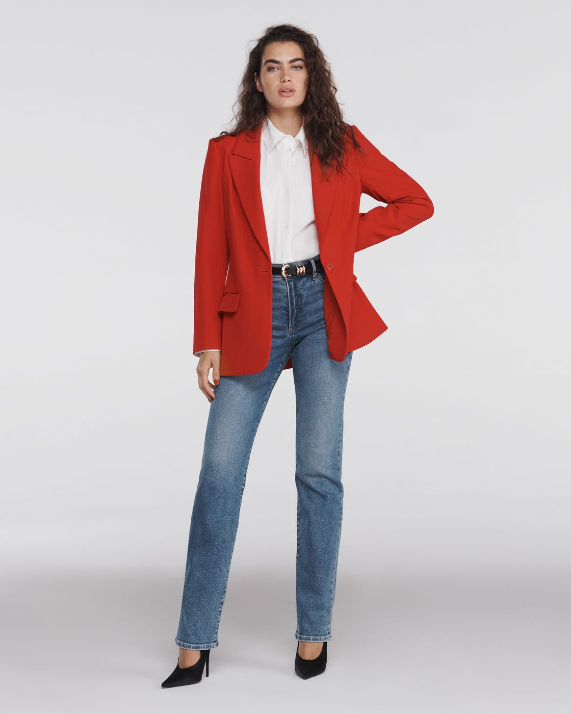 Stylish outfit featuring a red blazer white shirt and blue jeans