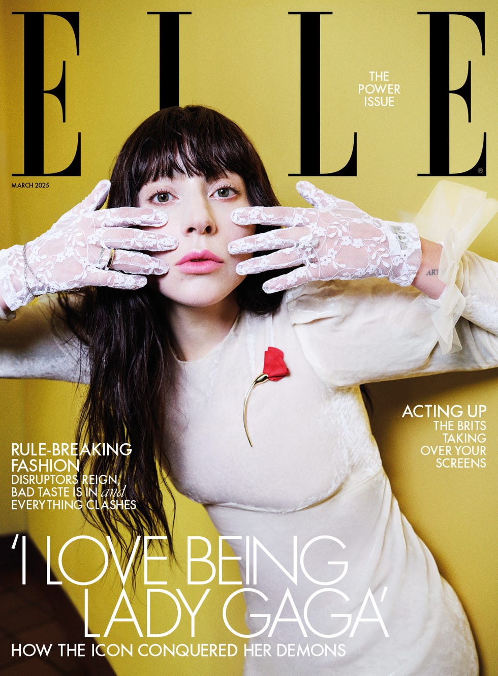 cover of elle magazine featuring a model with lace gloves and a rose