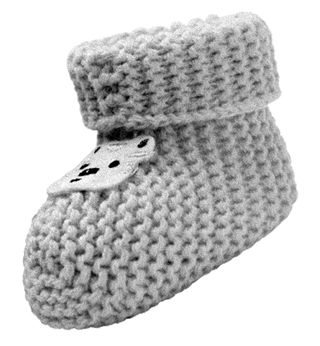 a black and white photo of a knitted baby sock