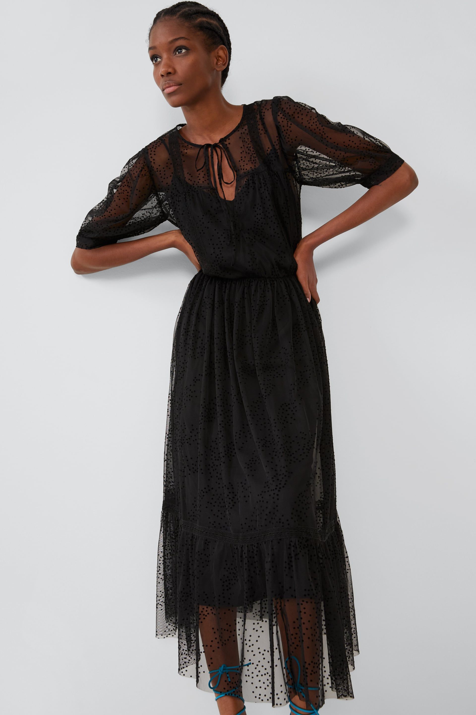 vestido largo negro de abullonada y plumeti de Zara