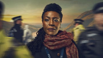 a police officer in a scenic background with officers in motion