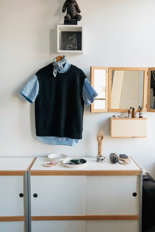 shirt and spencer with scarf of clothing hanger in a white and beige interior