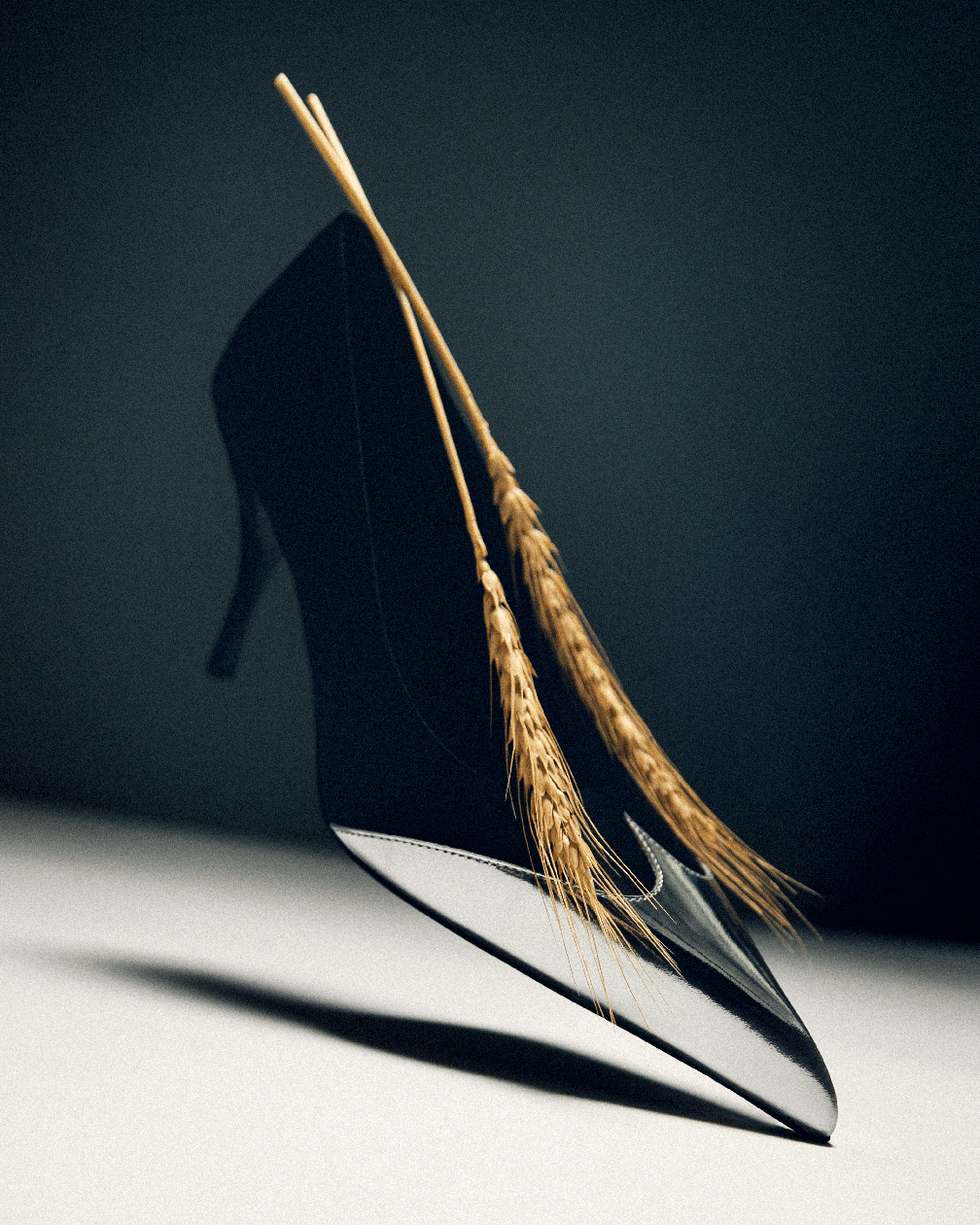 high heeled black shoe adorned with wheat stalks