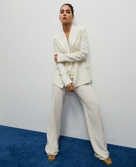 adria arjona models a white suit and diamond rings