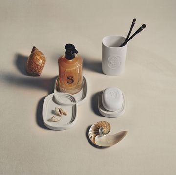 a table with a bottle and cups