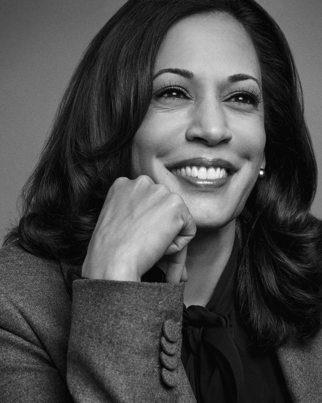 vice president kamala harris smiling with her hand on her chin