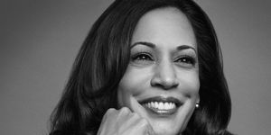vice president kamala harris smiling with her hand on her chin