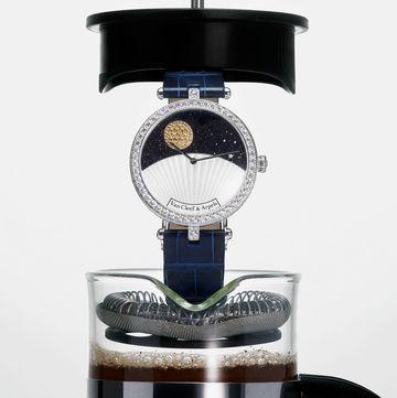 a watch inside a coffee bean press