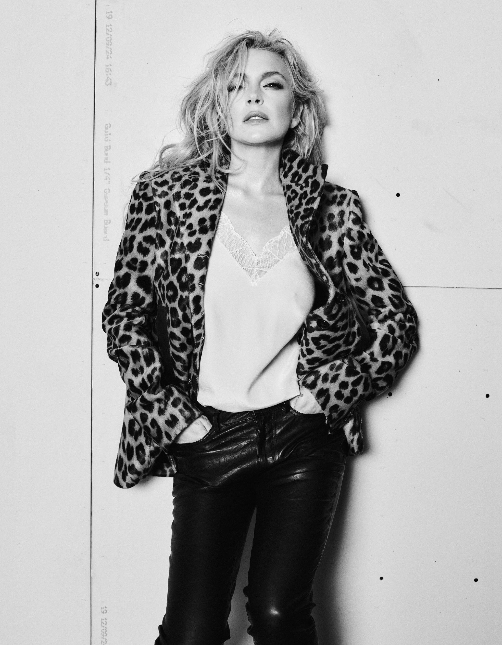lindsay lohan wearing a leopard print jacket and black pants