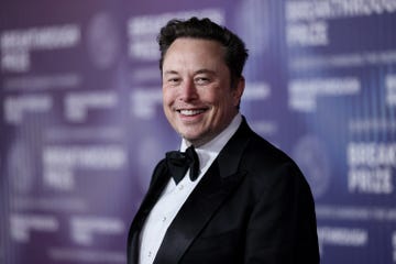 elon musk smiles at the camera as he looks over one shoulder, he wears a black tuxedo and bowtie with a white collared shirt, photo by etienne laurent afp photo by etienne laurentafp via getty images