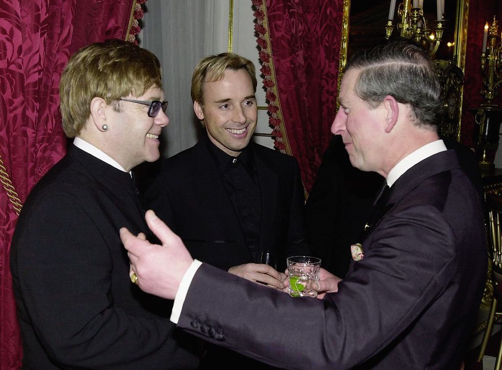 london march 12 sir elton john and partner david furnish greet prince charles, prince of wales at a dinner to celebrate the 25th anniversary of the princestrust at st jamess palace on march 12, 2001 in london, england photo by anwar husseingetty images