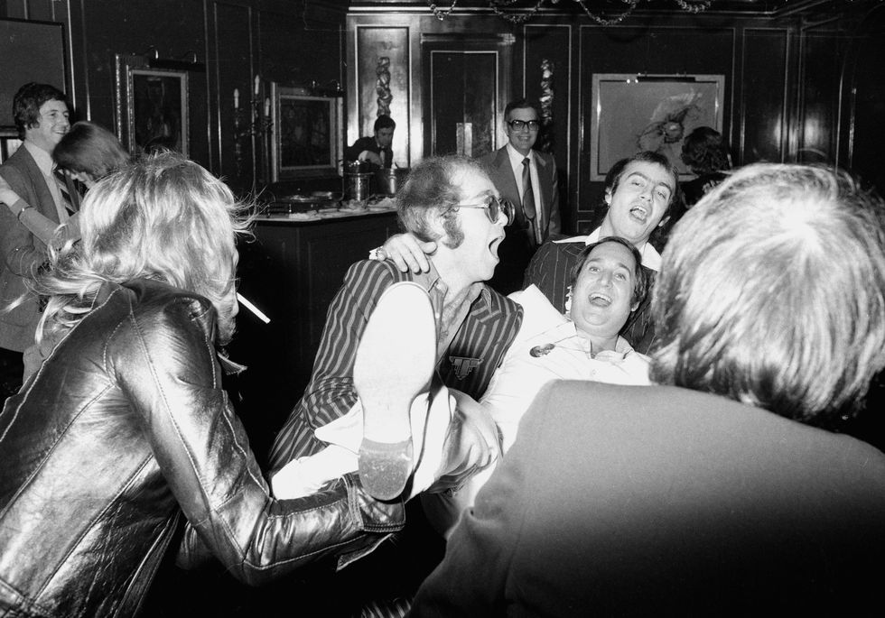 Elton John, Neil Sedaka and Bernie Taupin partying in London, England in 1975