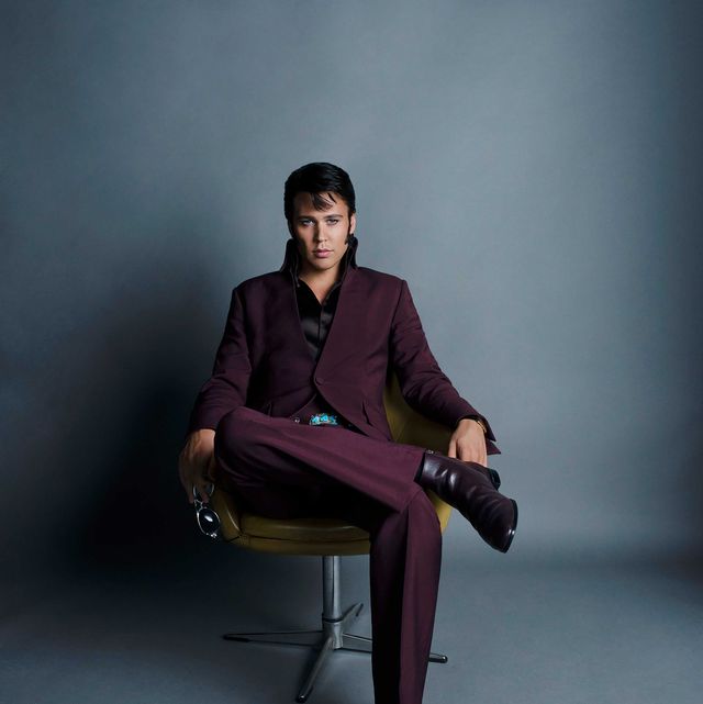 the actor austin butler portraying elvis, seated in a chair
