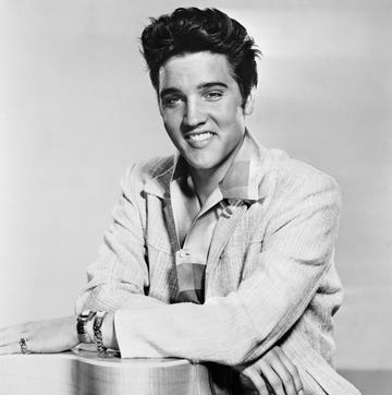 Elvis Presley with Guitar elvis presley with his arms resting on a guitar