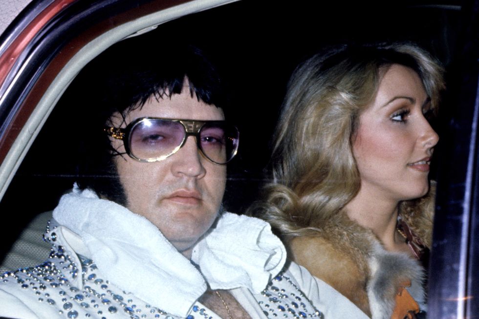 Elvis Presley With Girlfriend Linda Thompson Arrive At Hotel After Concert - March 21, 1976