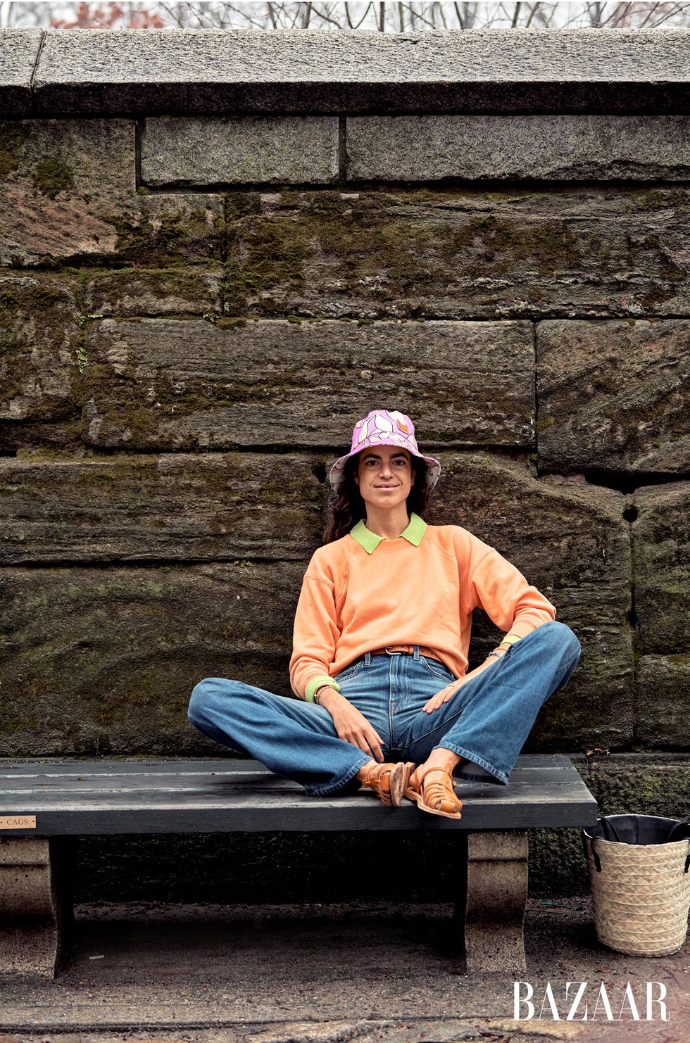 leandra sits on a bench