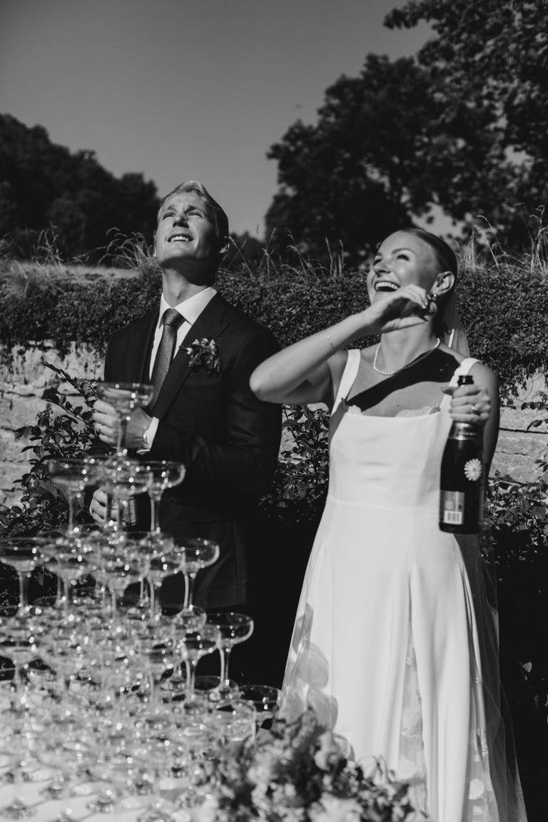 a man and woman holding wine glasses