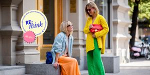 stockholm, sweden   august 28 emili sindlev wearing yellow knit cardigan, green wide leg pants, burberry clutch and jeannette madsen wearing orange midi skirt, ankle boots, light blue blazer, navy clutch seen during stockholm runway ss19 on august 28, 2018 in stockholm, sweden photo by christian vieriggetty images
