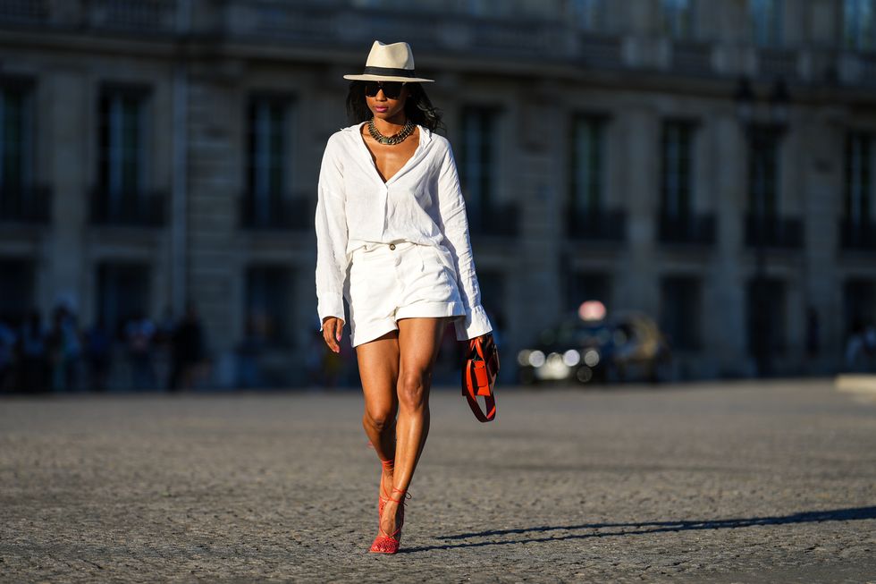 all white outfit for women 2023 white button down and shorts sun hat