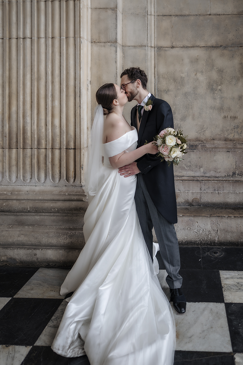 st pauls cathedral london wedding a bride and groom kissing