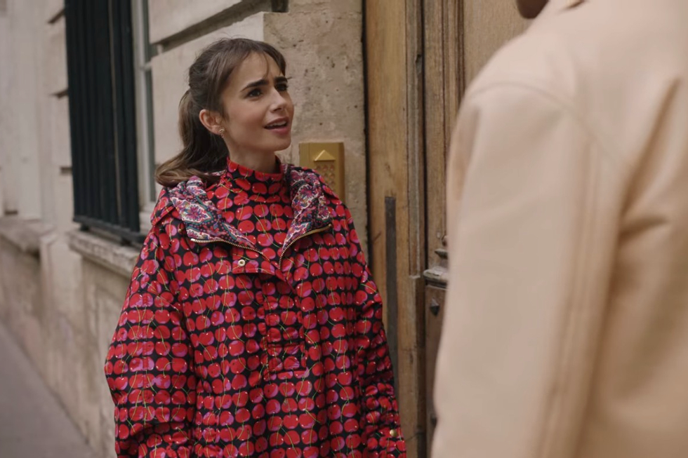 lily collins wearing a cherry patterned anorak in emily in paris season 3