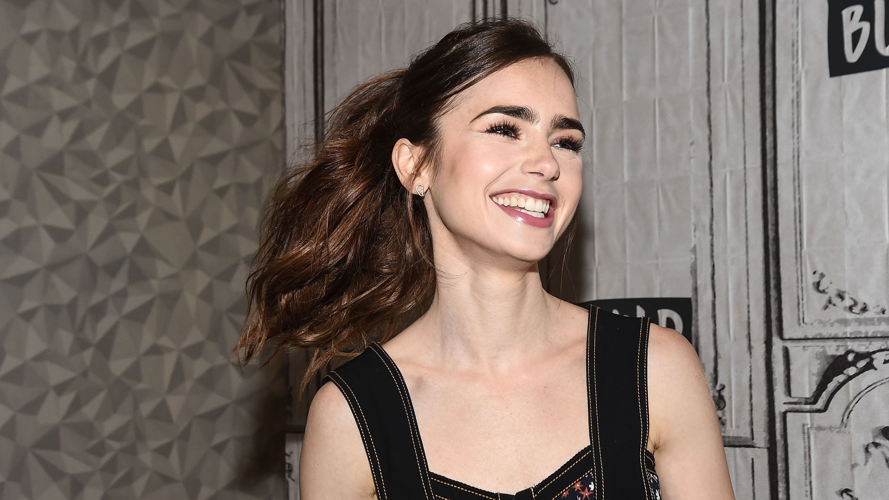 Lily Collins is seen leaving the 'CHANEL' Cambon store on July 9