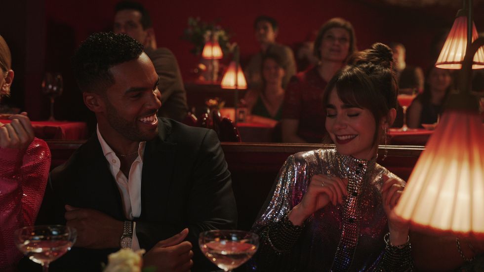 emily in paris l to r lucien laviscount as alfie, lily collins as emily in episode 303 of emily in paris cr courtesy of netflix © 2022