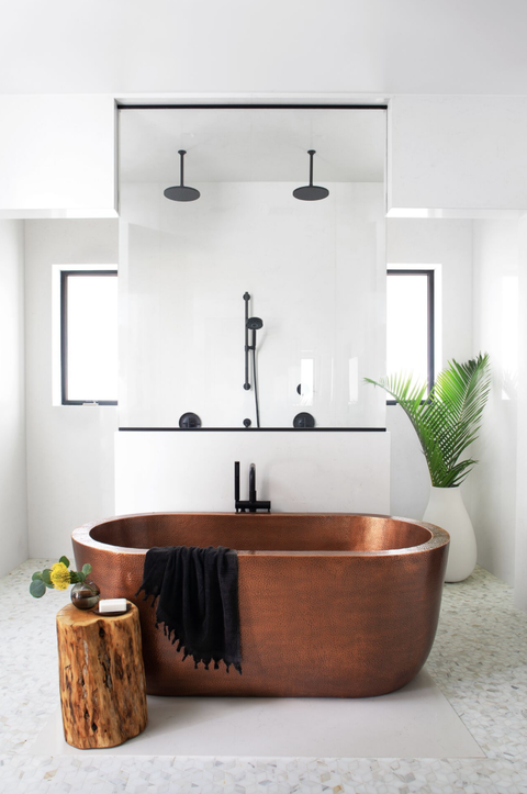 copper tub in a white bathroom