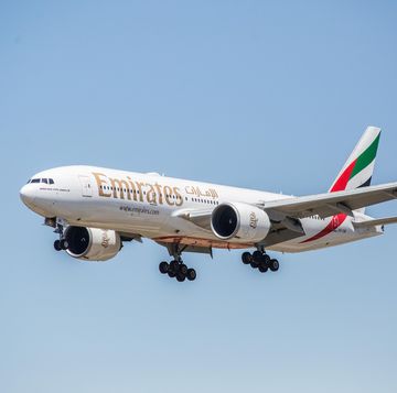 emirates airline, boeing 777 300er airplane is seen landing