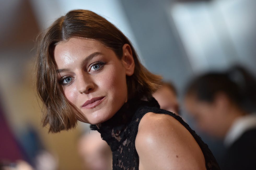 emma corrin at a red carpet event for pennyworth