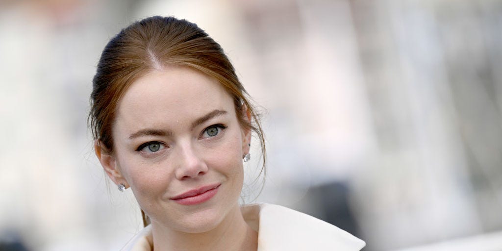 Emma Stone looks stunning in a plunging black and white blazer dress Emma Stone looks stunning in a plunging black and white blazer dress