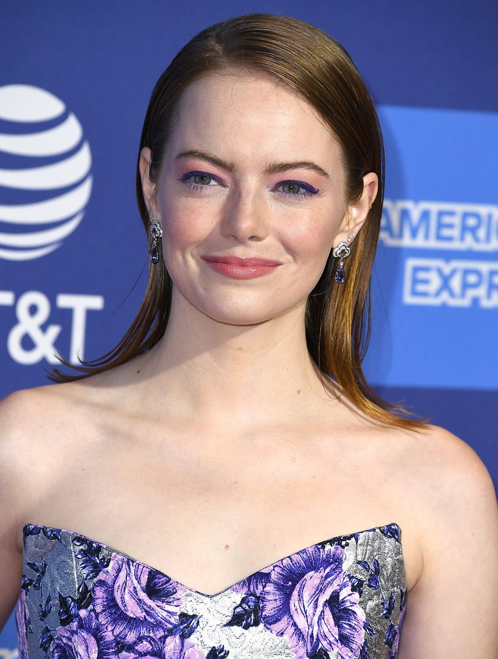 Emma Stone Arrives in the Shiniest Louis Vuitton Jumpsuit to the