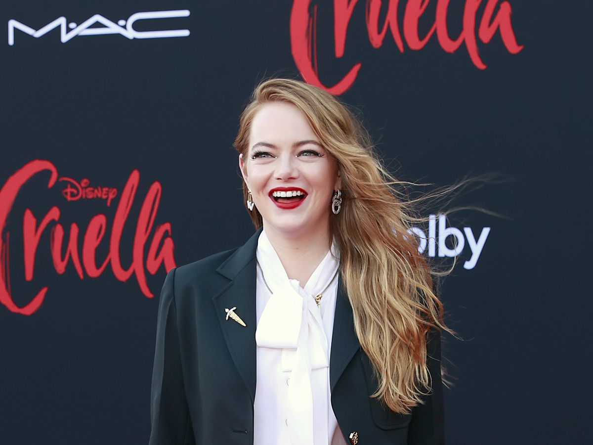Emma Stone Suits Up in Striped Blazer at Louis Vuitton's PFW Show