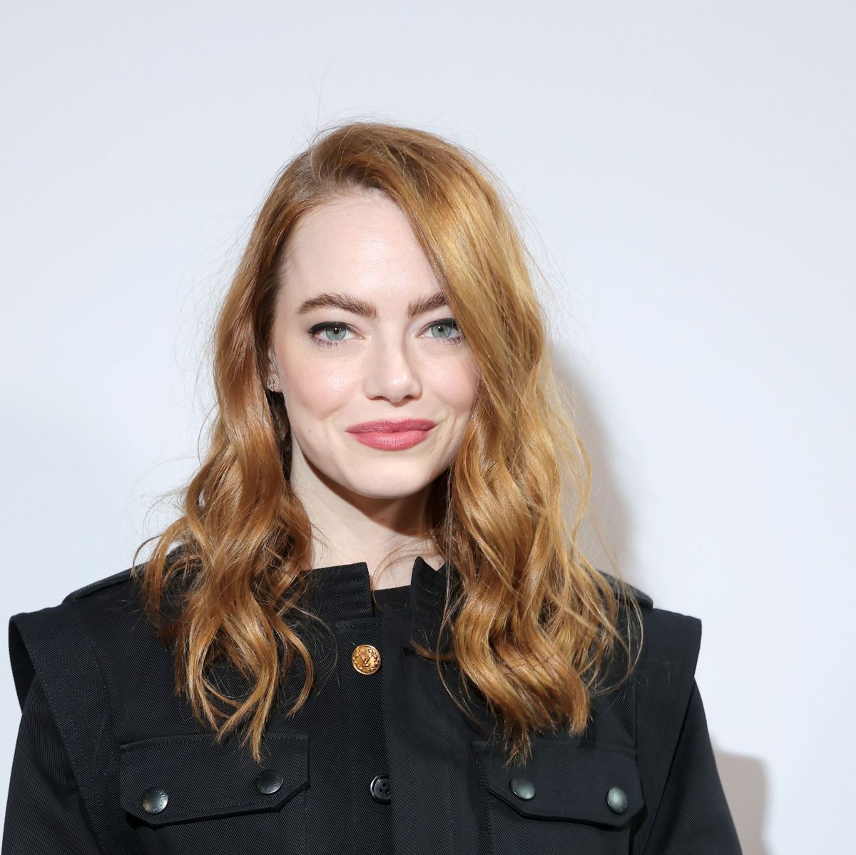 Emma Stone Wore Cropped Jacket and Mini Skirt at Louis Vuitton Show