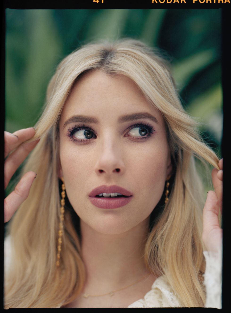 close up portrait shot of emma roberts in white lace dress