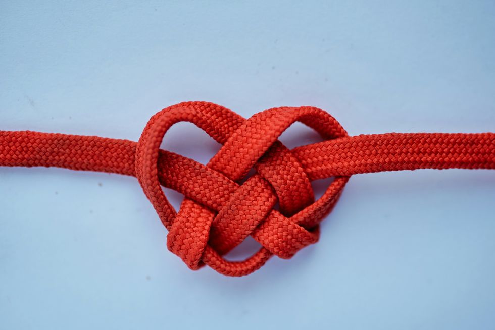 a red rope on a blue surface