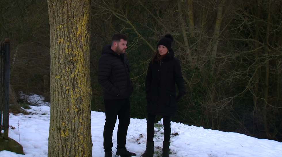 emmerdale, aaron dingle and chas dingle walking in the snow