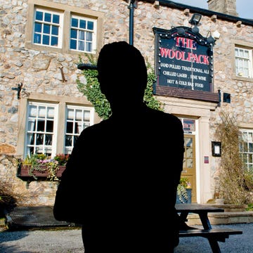 male silhouette in front of the woolpack pub in emmerdale