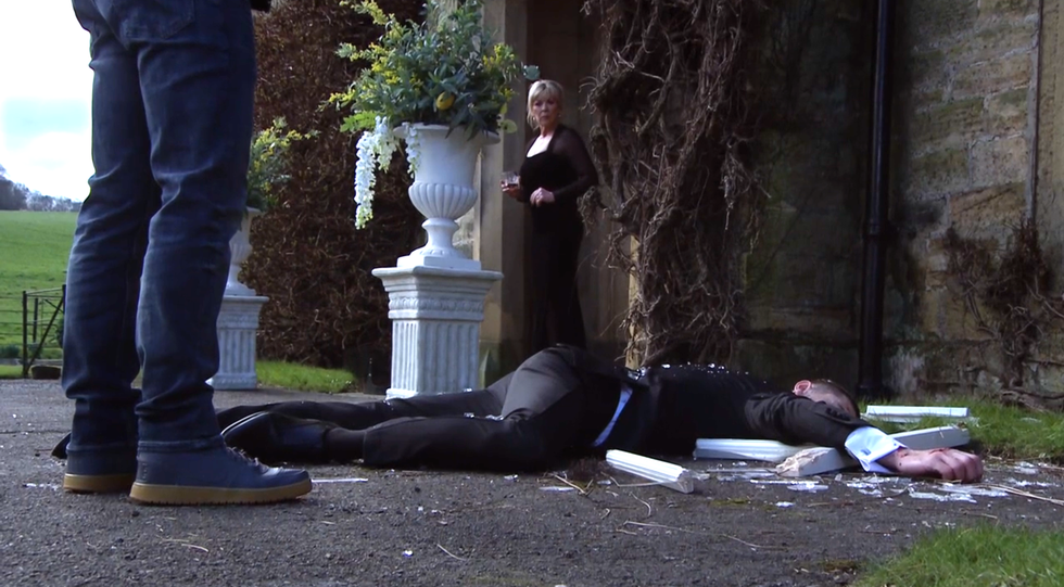 emmerdale's kim tate finding joe tate lying on the floor after his fall
