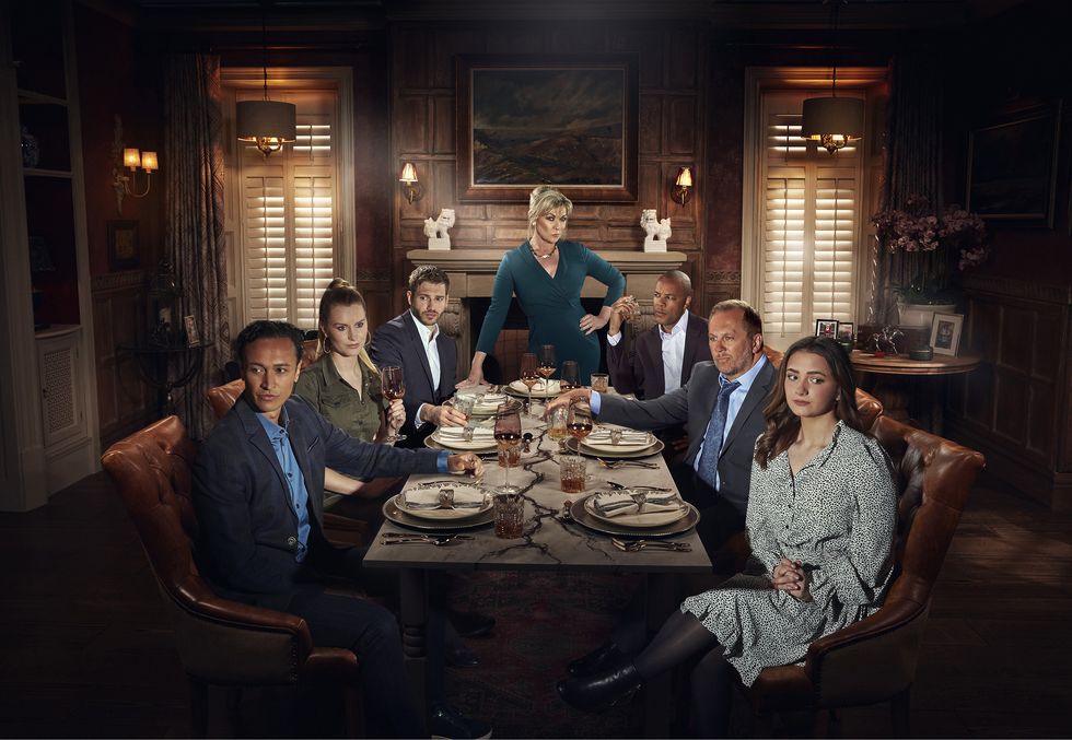 emmerdale's jai sharma, dawn taylor, jamie tate, kim tate, al chapman, will taylor and gabby thomas are pictured around a table as kim tate sets a new plan into motion