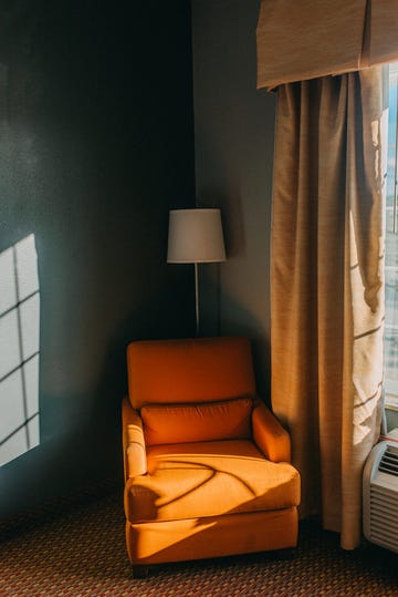 empty orange armchair in a room